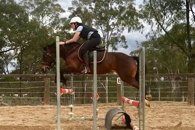 Riding School pony Nikita jumping with Jade