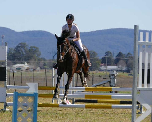 Lilly riding at a showjumping competition